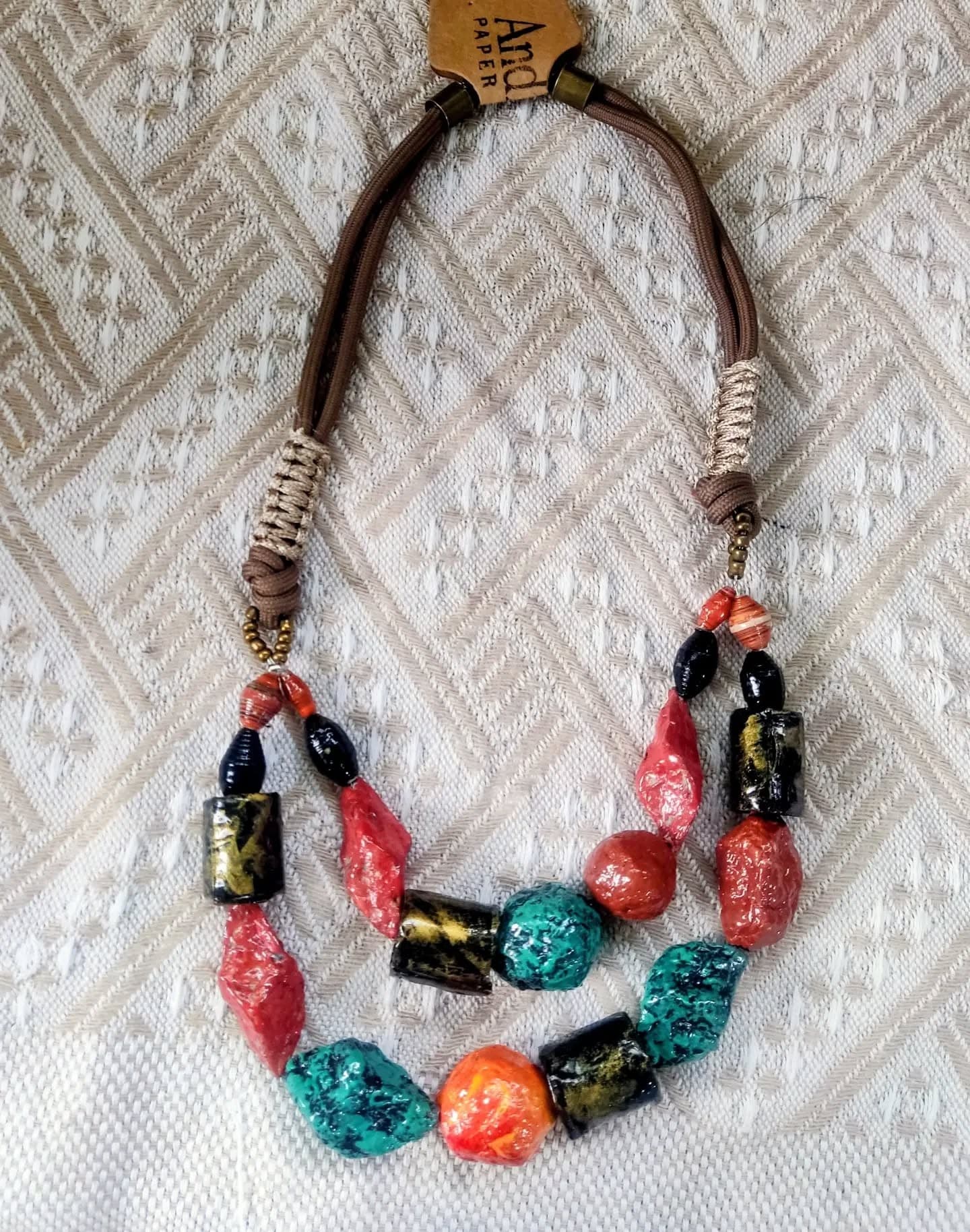 TERRA Necklace with chunky coral, turquoise, and gold-flecked black paper beads on a brown cord